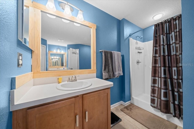 3946 SW 133rd Loop, Ocala, FL 34473 - bathroom featuring curtained shower, vanity, a textured wall, and tile patterned flooring