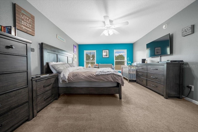 3946 SW 133rd Loop, Ocala, FL 34473 - bedroom with light carpet, ceiling fan, and a textured ceiling