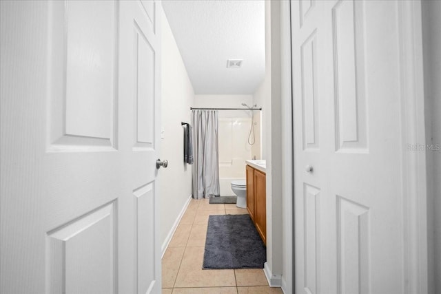 3946 SW 133rd Loop, Ocala, FL 34473 - bathroom featuring vanity, tile patterned floors, and shower / bath combination with curtain