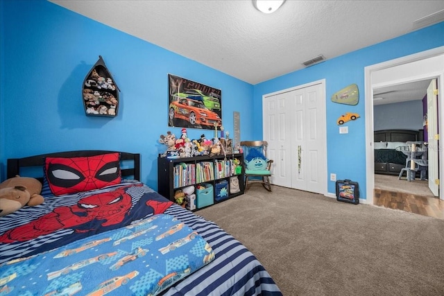 3946 SW 133rd Loop, Ocala, FL 34473 - bedroom with carpet flooring, a textured ceiling, and a closet