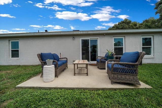 3946 SW 133rd Loop, Ocala, FL 34473 - back of house featuring outdoor lounge area, a patio, a lawn, and stucco siding