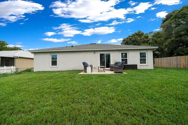 3946 SW 133rd Loop, Ocala, FL 34473 - back of house featuring stucco siding, a fenced backyard, a patio, and an outdoor living space