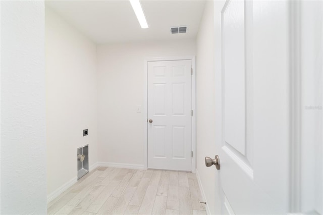 238 Locust Pass Cir, Ocala, FL 34472 - laundry room with electric dryer hookup and light wood-type flooring