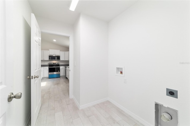 238 Locust Pass Cir, Ocala, FL 34472 - washroom featuring hookup for an electric dryer, washer hookup, and light wood-style flooring