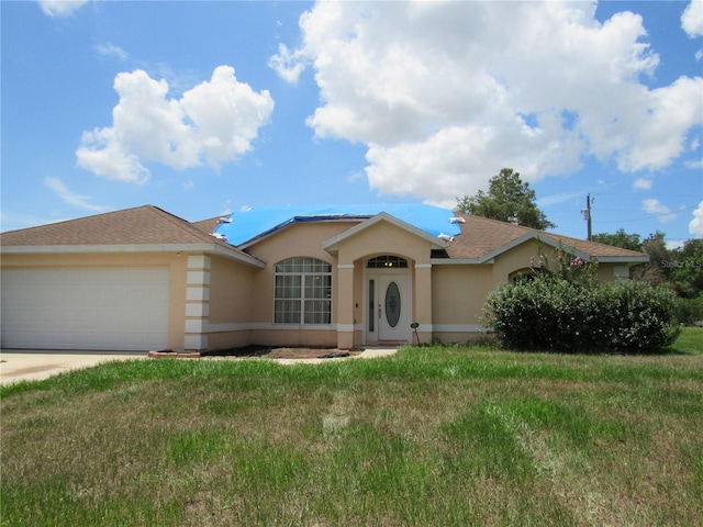 2640 SW 154th Place Rd, Ocala, FL 34473 - ranch-style house with stucco siding, an attached garage, a front yard, and concrete driveway
