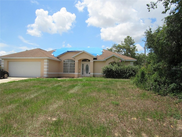 2640 SW 154th Place Rd, Ocala, FL 34473 - ranch-style house featuring stucco siding, a garage, concrete driveway, and a front yard