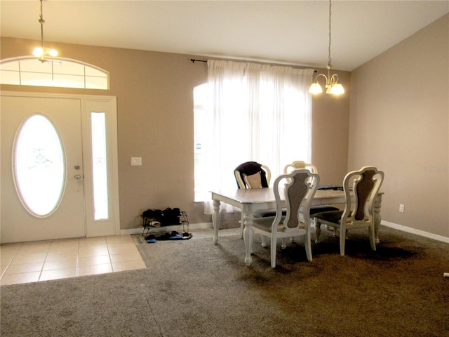 2640 SW 154th Place Rd, Ocala, FL 34473 - dining room with a chandelier, healthy amount of natural light, carpet floors, and tile patterned floors