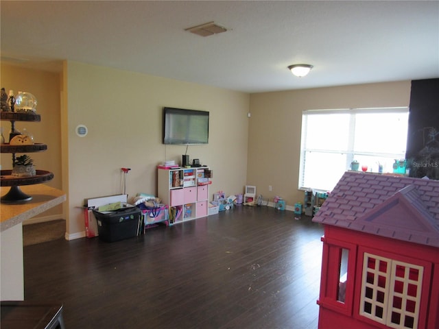 2640 SW 154th Place Rd, Ocala, FL 34473 - playroom with dark wood-style floors and baseboards