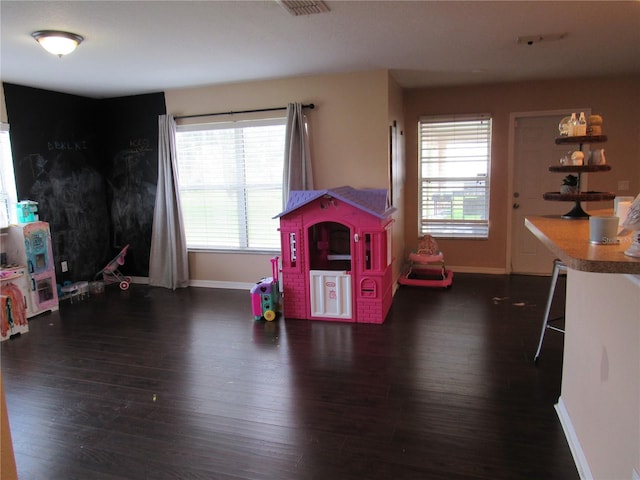 2640 SW 154th Place Rd, Ocala, FL 34473 - game room with wood finished floors and plenty of natural light