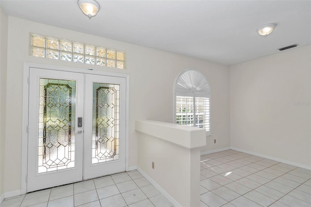 5210 Camberlea Ave, Zephyrhills, FL 33541 - entrance foyer featuring french doors and light tile patterned floors
