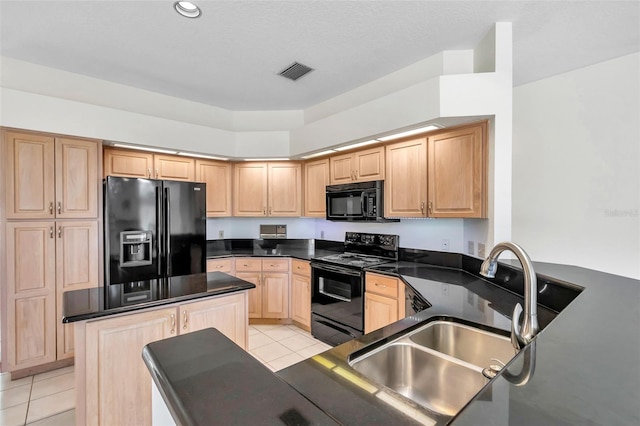 5210 Camberlea Ave, Zephyrhills, FL 33541 - kitchen with black appliances, light brown cabinets, light tile patterned floors, and dark countertops