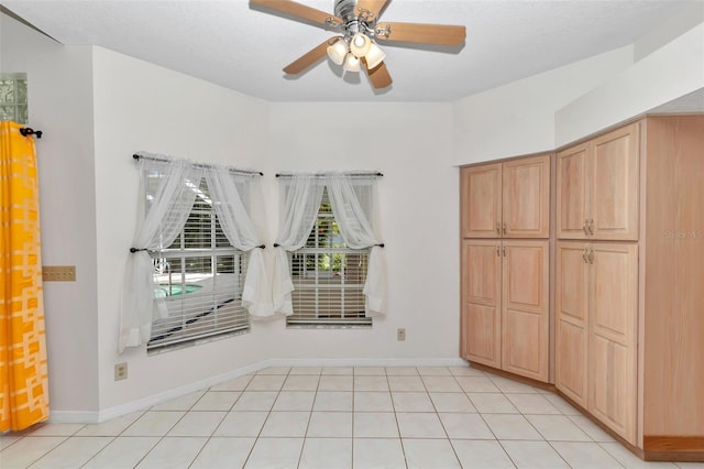 5210 Camberlea Ave, Zephyrhills, FL 33541 - unfurnished bedroom with light tile patterned flooring and a ceiling fan