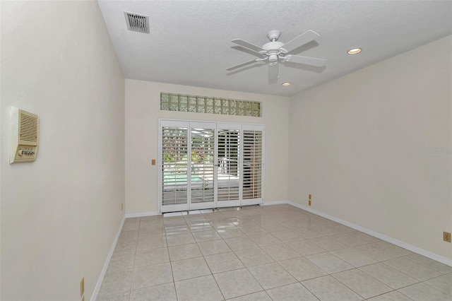 5210 Camberlea Ave, Zephyrhills, FL 33541 - empty room with ceiling fan, a textured ceiling, light tile patterned floors, and recessed lighting