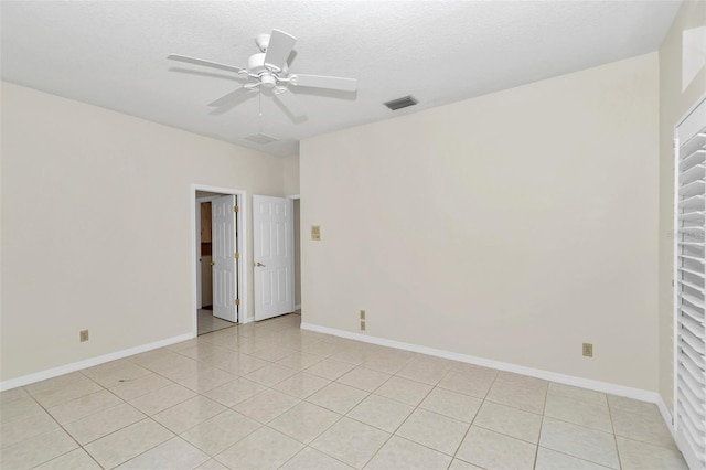 5210 Camberlea Ave, Zephyrhills, FL 33541 - unfurnished room featuring a ceiling fan, light tile patterned floors, and a textured ceiling