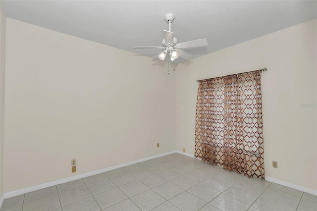 5210 Camberlea Ave, Zephyrhills, FL 33541 - empty room with ceiling fan and light tile patterned floors