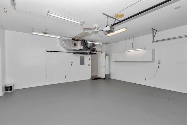 5210 Camberlea Ave, Zephyrhills, FL 33541 - garage with electric panel and a garage door opener