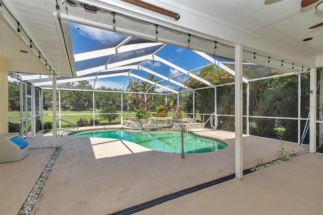 5210 Camberlea Ave, Zephyrhills, FL 33541 - swimming pool featuring ceiling fan, a patio area, an in-ground hot tub, and glass enclosure