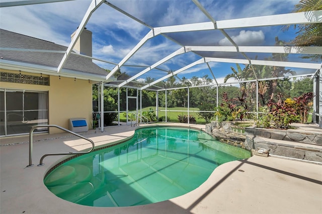 5210 Camberlea Ave, Zephyrhills, FL 33541 - swimming pool featuring a patio and glass enclosure