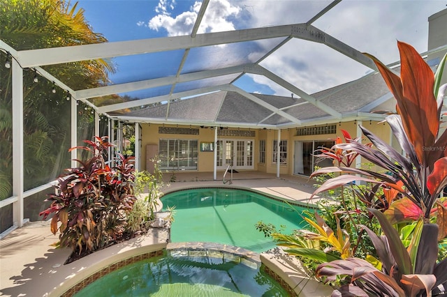 5210 Camberlea Ave, Zephyrhills, FL 33541 - view of swimming pool with a patio, a pool with connected hot tub, a lanai, and french doors