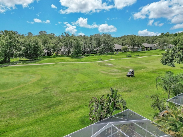 5210 Camberlea Ave, Zephyrhills, FL 33541 - surrounding community featuring view of golf course, view of wooded area, and a lawn