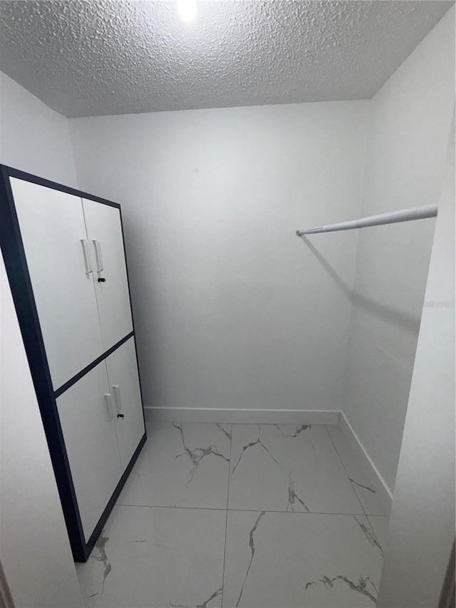 3585 N Hiawatha Ter, Crystal River, FL 34428 - walk in closet with light marble finish flooring