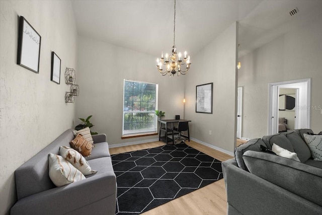 3520 NW 46th Ter, Gainesville, FL 32606 - living room featuring dark wood finished floors, a chandelier, and high vaulted ceiling