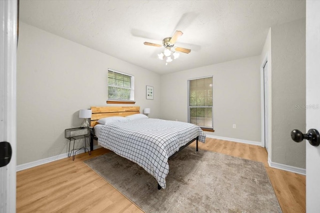 3520 NW 46th Ter, Gainesville, FL 32606 - bedroom featuring light wood finished floors and ceiling fan