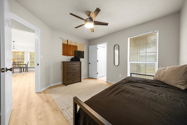 3520 NW 46th Ter, Gainesville, FL 32606 - bedroom featuring light wood finished floors and a ceiling fan
