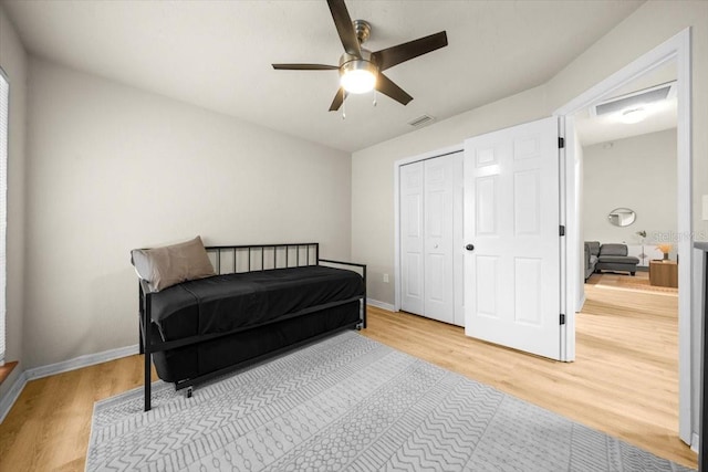3520 NW 46th Ter, Gainesville, FL 32606 - bedroom with wood finished floors, ceiling fan, and a closet