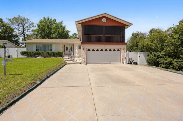6 Emerald Crse, Ocala, FL 34472 - view of front facade with a gate, a garage, driveway, and stucco siding