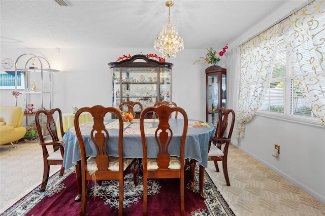6 Emerald Crse, Ocala, FL 34472 - dining space featuring a chandelier and carpet