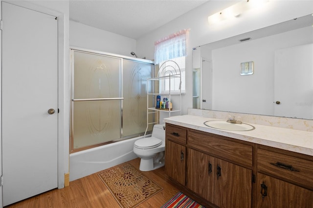 6 Emerald Crse, Ocala, FL 34472 - full bathroom with wood finished floors, vanity, and combined bath / shower with glass door