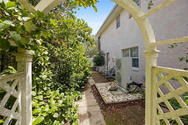 6 Emerald Crse, Ocala, FL 34472 - view of property exterior featuring stucco siding and a cooling unit