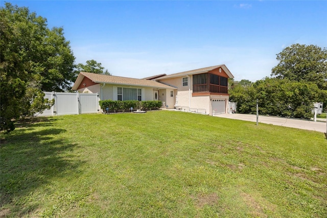 6 Emerald Crse, Ocala, FL 34472 - tri-level home with an attached garage, a gate, driveway, a sunroom, and stucco siding