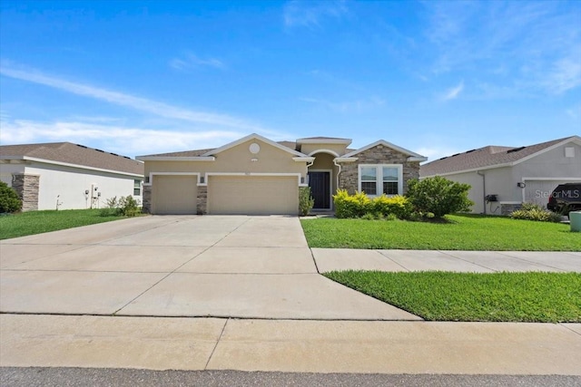 5833 SW 85th Pl, Ocala, FL 34476 - view of front of property with stone siding, a garage, concrete driveway, a front lawn, and stucco siding