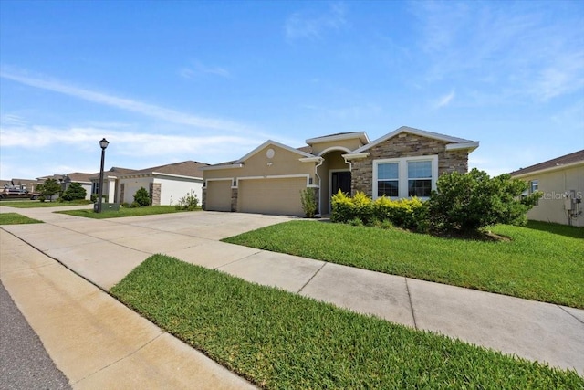 5833 SW 85th Pl, Ocala, FL 34476 - ranch-style home featuring concrete driveway, an attached garage, a front yard, stucco siding, and stone siding