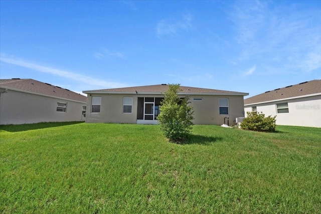 5833 SW 85th Pl, Ocala, FL 34476 - rear view of house featuring a yard and stucco siding