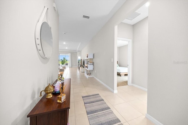 5833 SW 85th Pl, Ocala, FL 34476 - corridor featuring baseboards and light tile patterned flooring