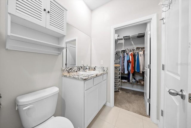 5833 SW 85th Pl, Ocala, FL 34476 - bathroom with vanity, a spacious closet, and tile patterned floors