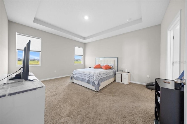 5833 SW 85th Pl, Ocala, FL 34476 - bedroom with light colored carpet and a tray ceiling