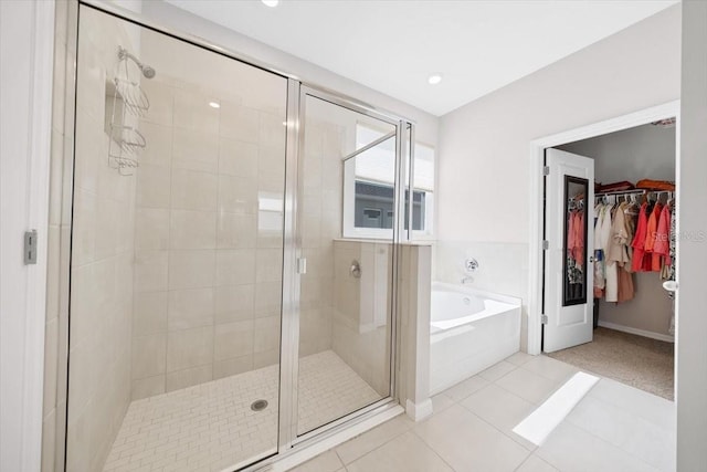 5833 SW 85th Pl, Ocala, FL 34476 - full bath with a garden tub, a stall shower, a spacious closet, and tile patterned floors