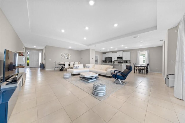 5833 SW 85th Pl, Ocala, FL 34476 - living room featuring a tray ceiling, recessed lighting, and light tile patterned floors
