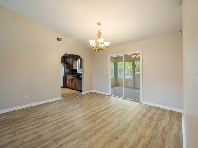17 Pecan Run Hbr, Ocala, FL 34472 - unfurnished room with light wood-style floors, a chandelier, and arched walkways