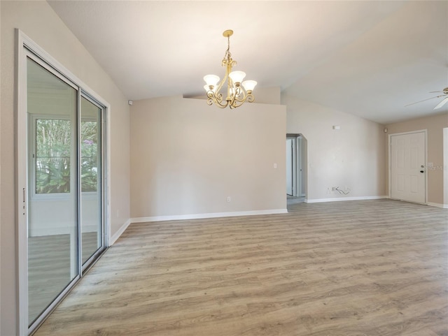 17 Pecan Run Hbr, Ocala, FL 34472 - spare room featuring a chandelier, lofted ceiling, light wood-style floors, and ceiling fan
