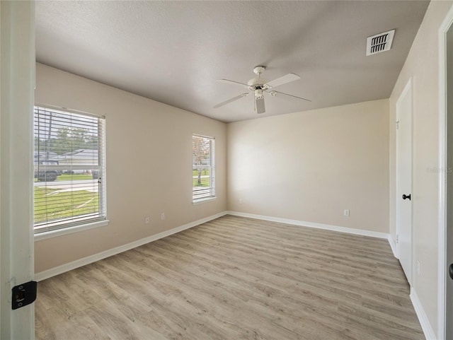 17 Pecan Run Hbr, Ocala, FL 34472 - unfurnished room featuring a ceiling fan and light wood-style flooring