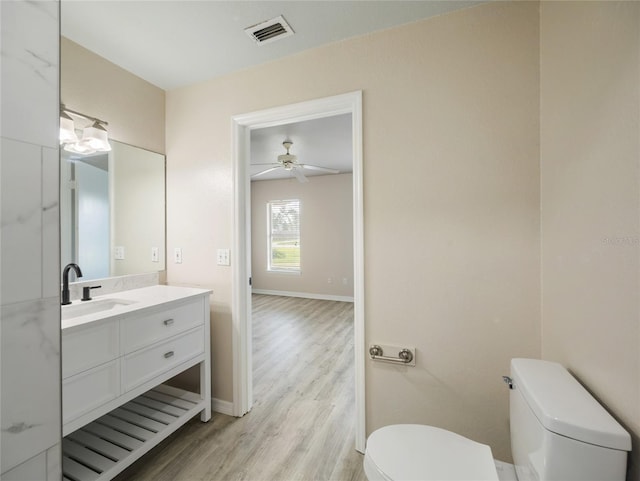 17 Pecan Run Hbr, Ocala, FL 34472 - half bathroom featuring vanity, wood finished floors, and a ceiling fan