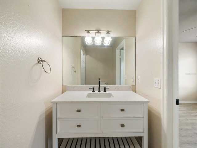 17 Pecan Run Hbr, Ocala, FL 34472 - bathroom featuring vanity, wood finished floors, and a chandelier