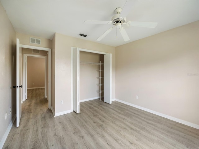 17 Pecan Run Hbr, Ocala, FL 34472 - unfurnished bedroom with light wood finished floors, a closet, and a ceiling fan