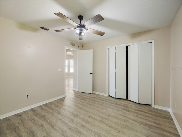 17 Pecan Run Hbr, Ocala, FL 34472 - unfurnished bedroom featuring light wood-type flooring, a closet, and ceiling fan