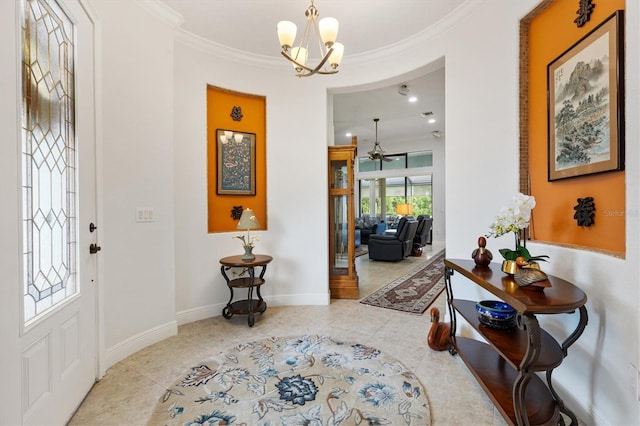 5233 Fountain Walk, Lady Lake, FL 32159 - foyer entrance featuring tile patterned floors, ornamental molding, a chandelier, and a ceiling fan